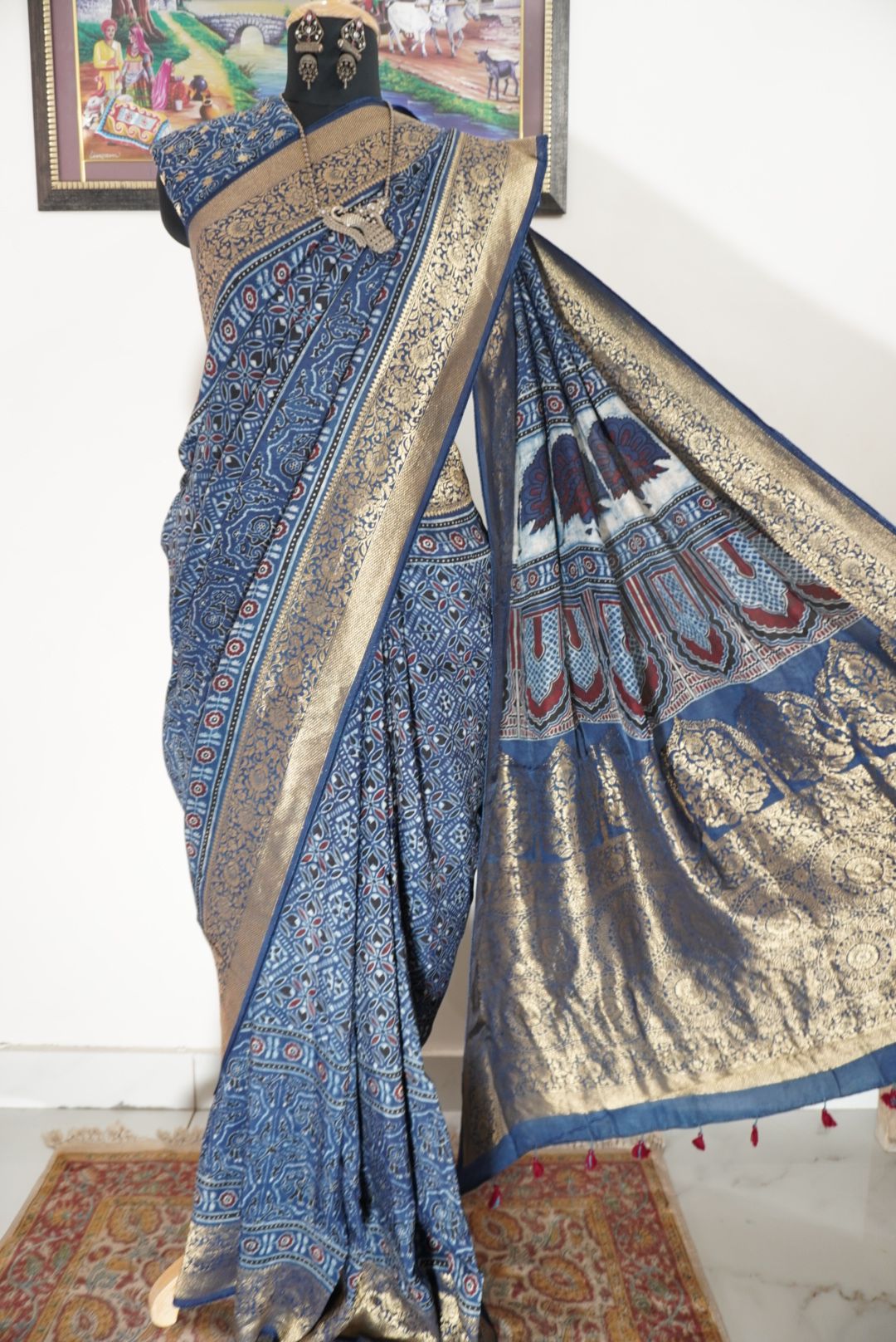 Dola silk Ajrakh saree in indigo blue with floral nakshi pallu, border, zari and thread tassels