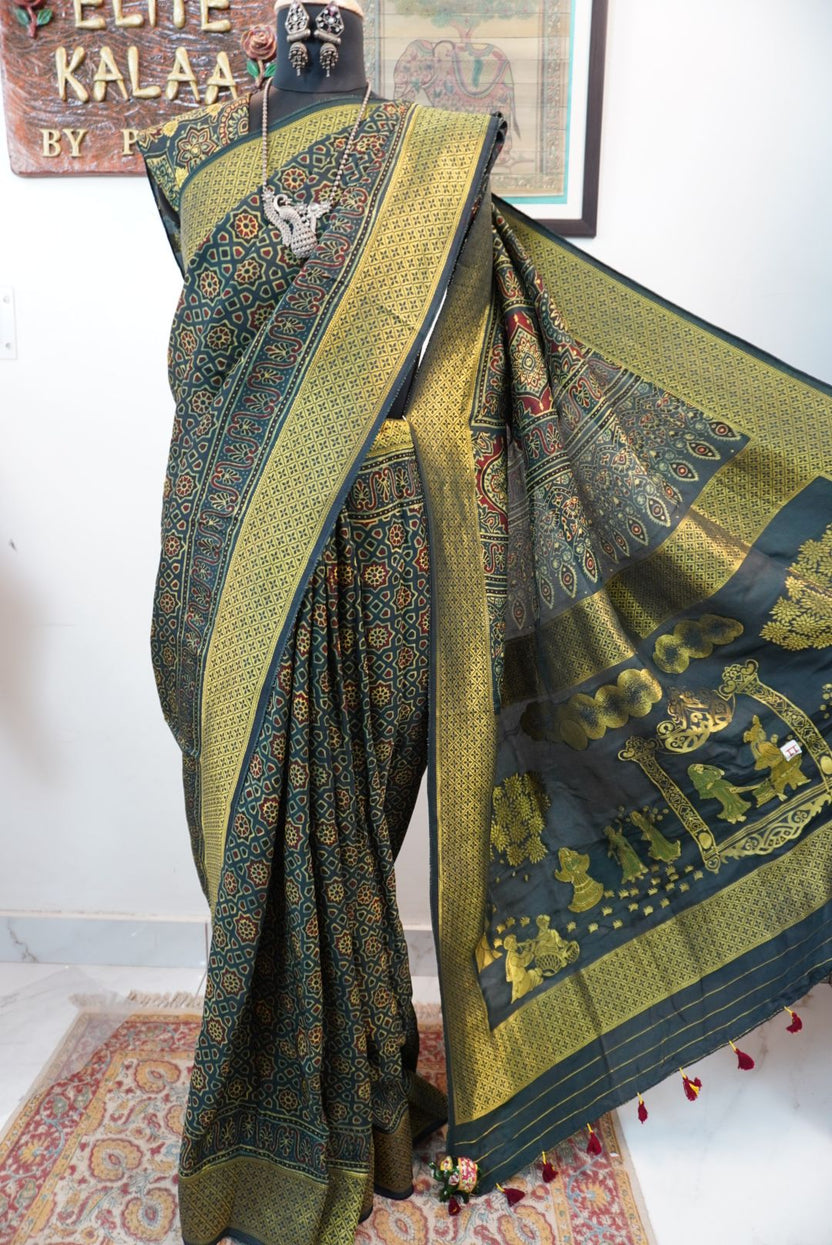 Green saree with multicolor geometric ajrakh pattern, border and tassels, with meenakari palla