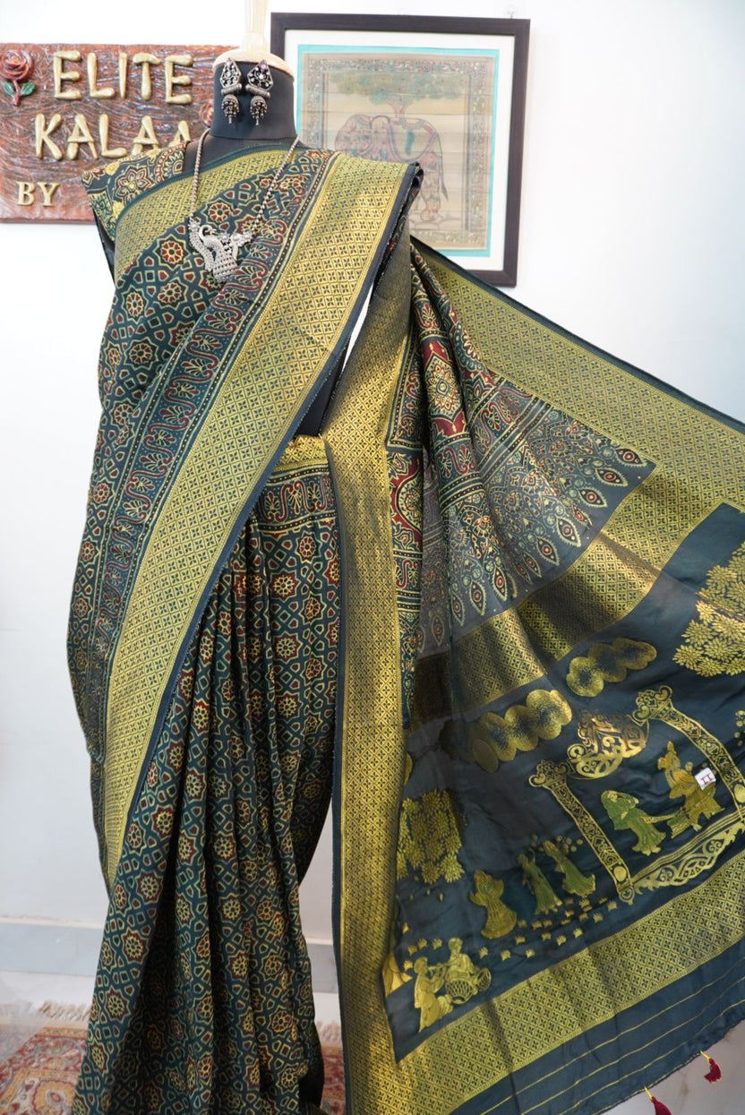 Green saree with multicolor geometric ajrakh pattern, border and tassels, with meenakari palla