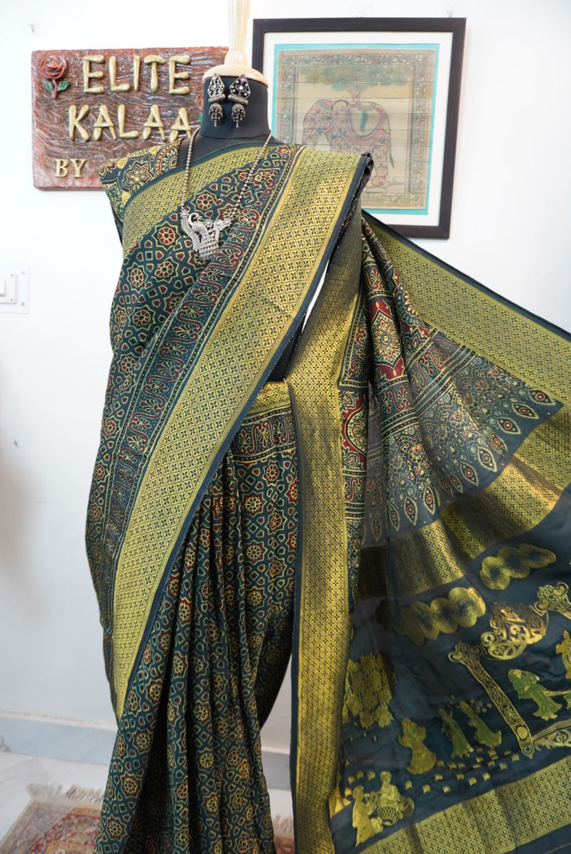 Green saree with multicolor geometric ajrakh pattern, border and tassels, with meenakari palla