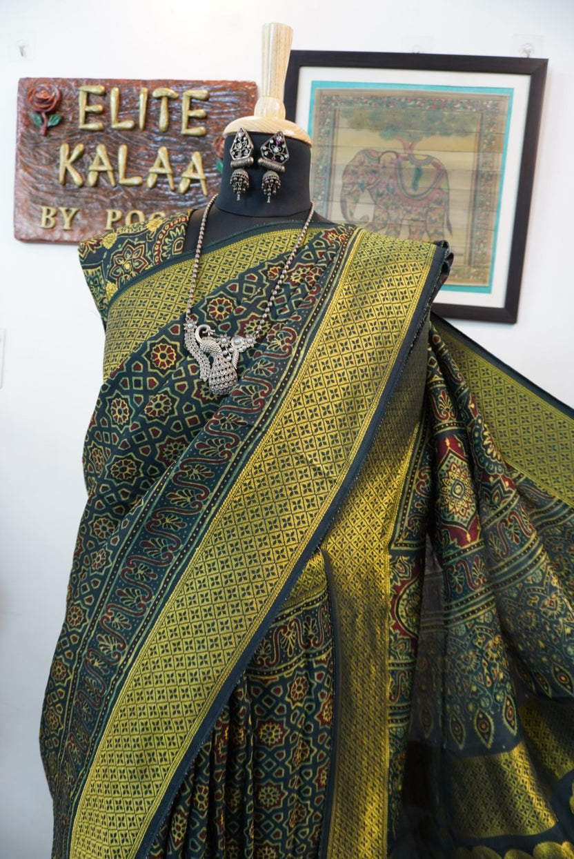 Green saree with multicolor geometric ajrakh pattern, border and tassels, with meenakari palla