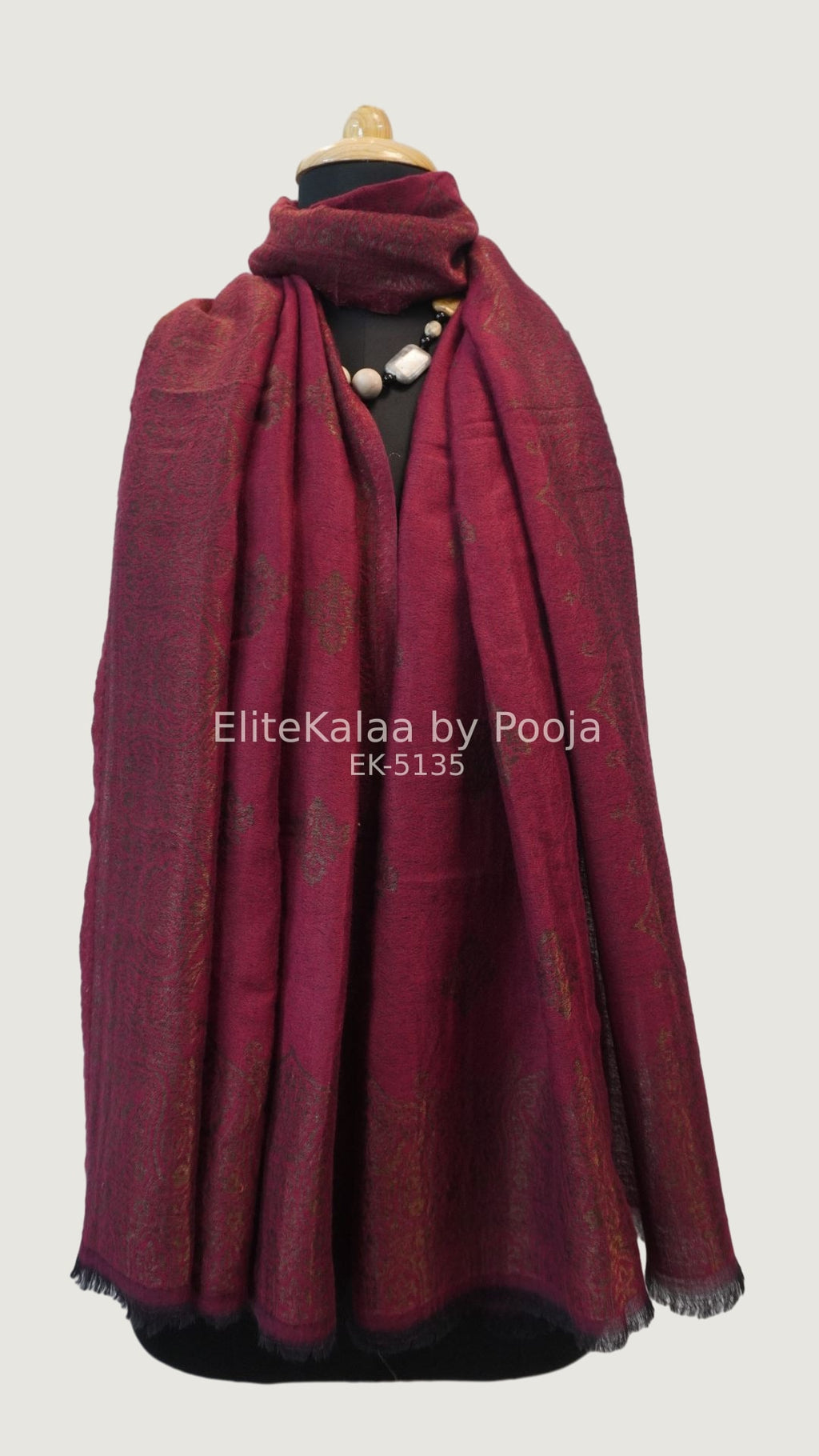 Deep maroon fine wool stole with self zari leaf design