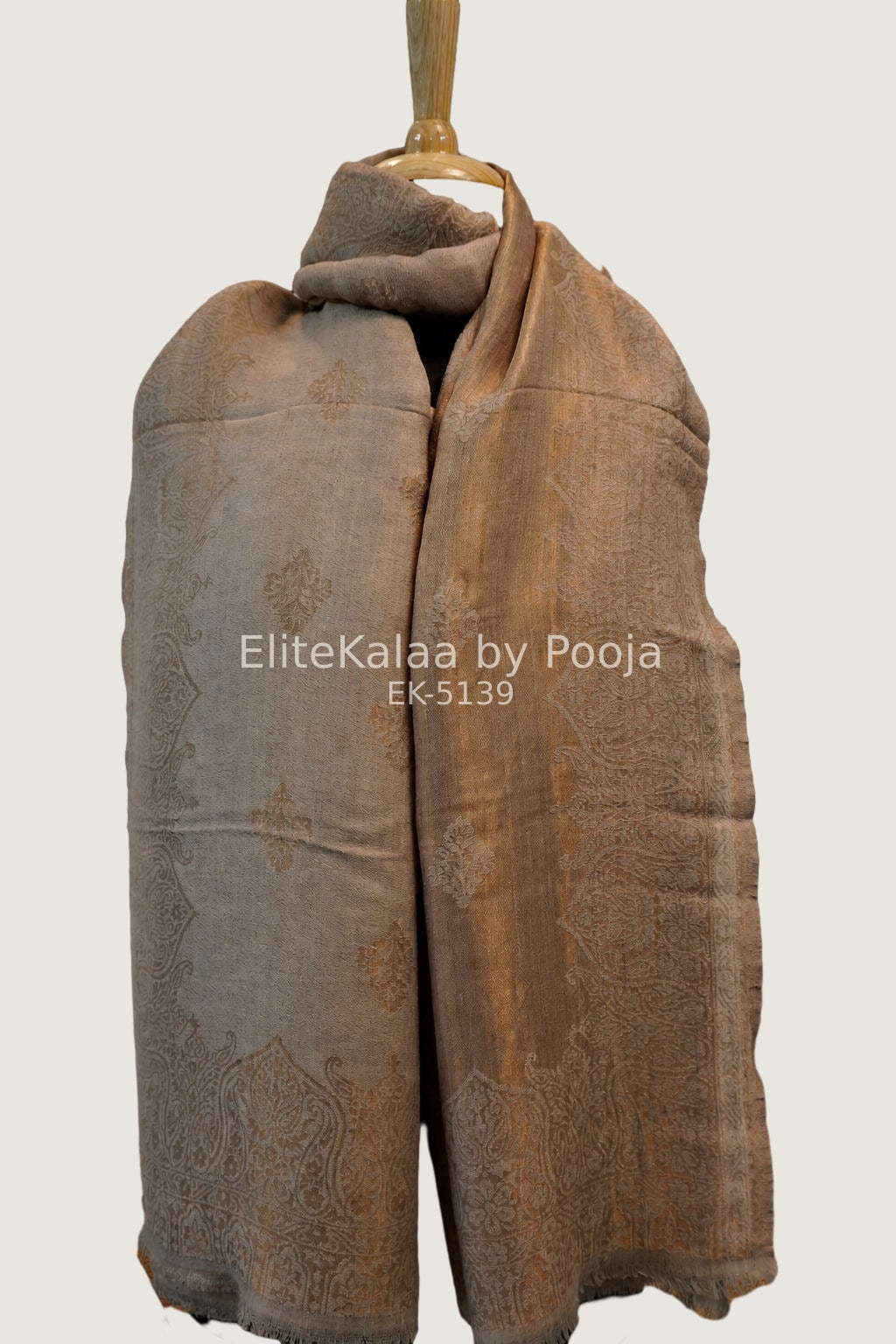 Beige fine wool stole with self zari leaf design and border detail