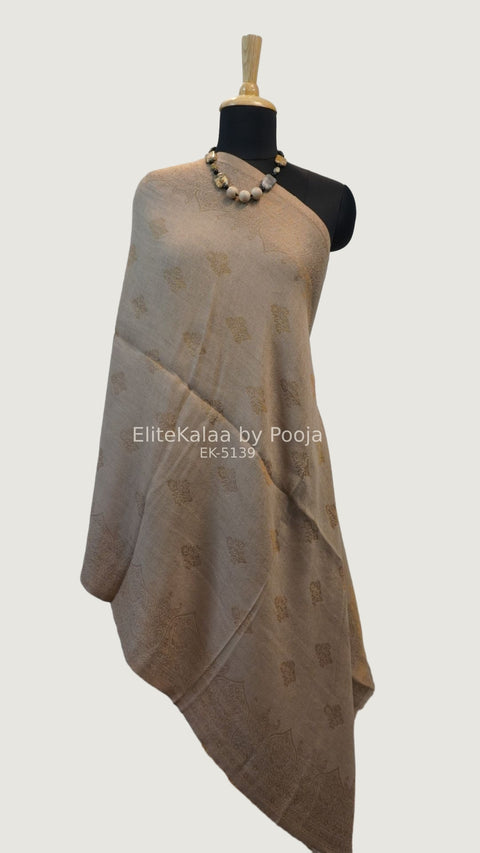 Beige fine wool stole with self zari leaf design and border detail
