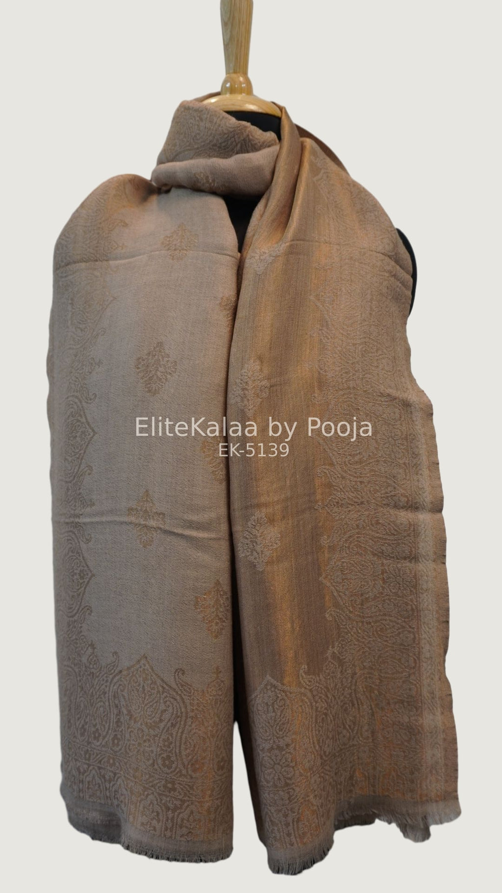 Beige fine wool stole with self zari leaf design and border detail