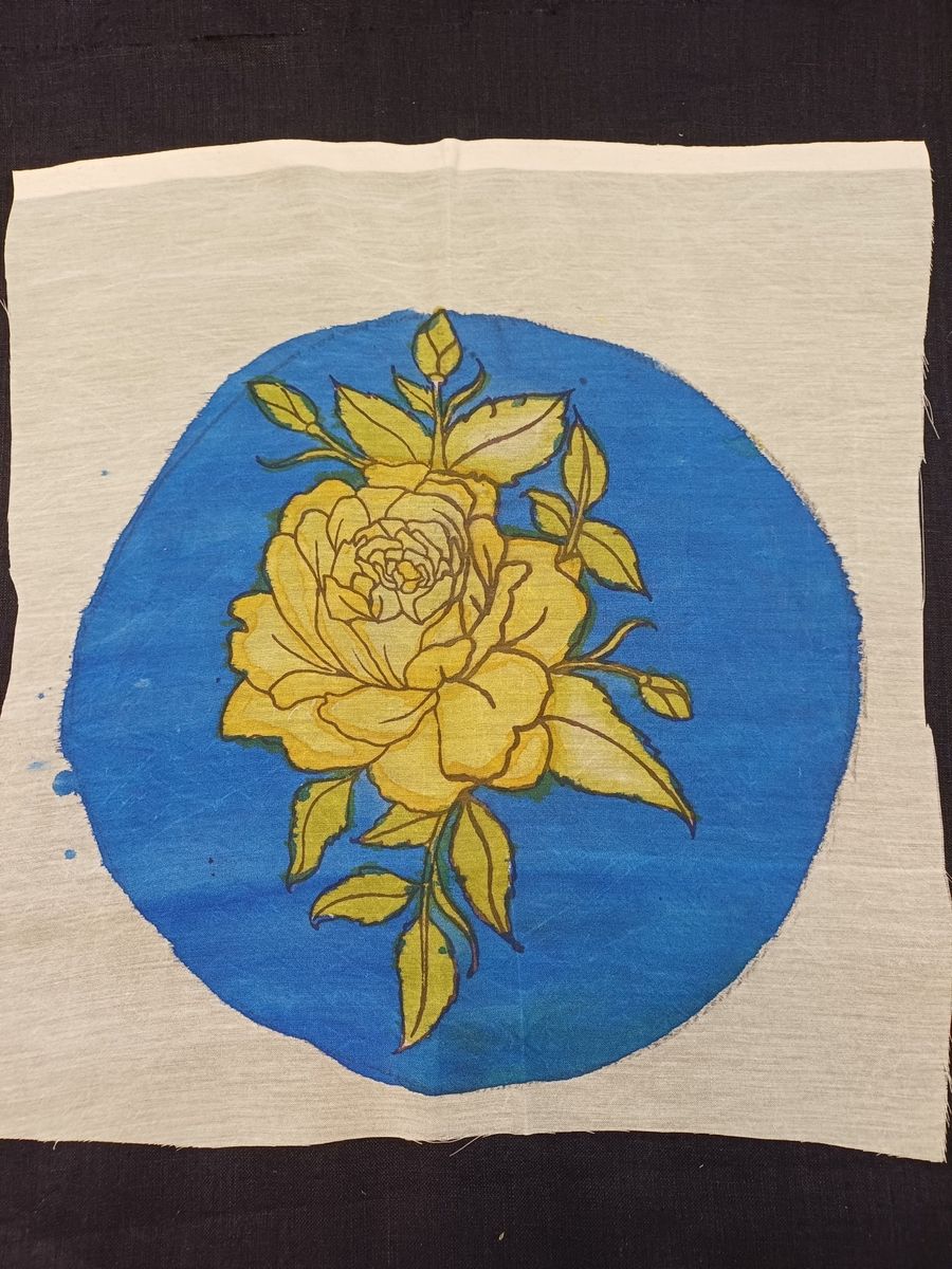 Kalamkari blue round patch with a rose design and circular format