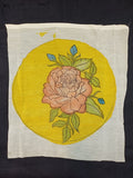 Kalamkari round patch in yellow with a rose design and border details