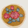 Yellow round Kalamkari floral patch with border detail and a rose-inspired design