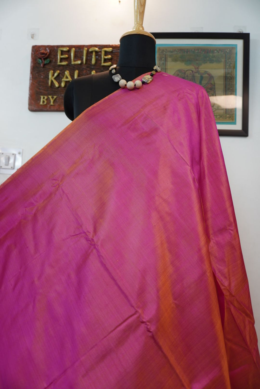 Pink and orange solid saree with border and multicolor design