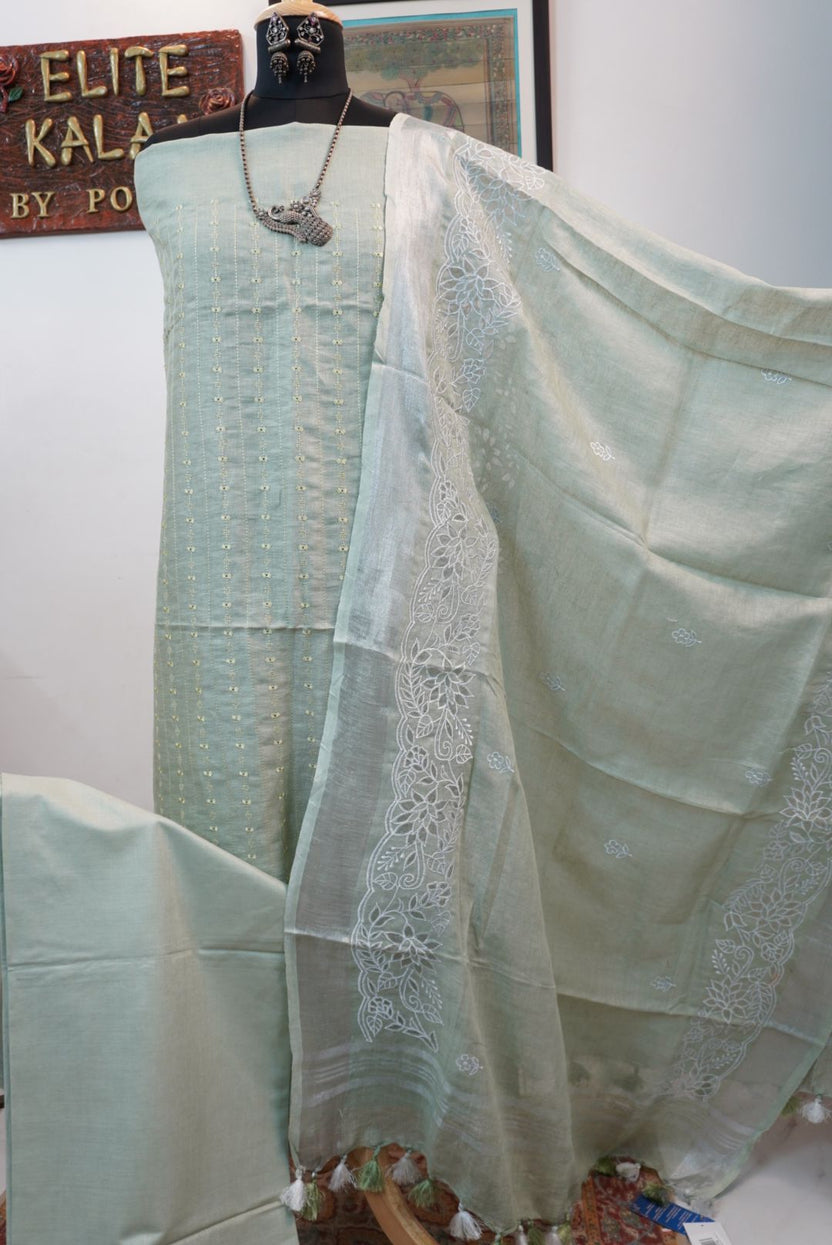Light green linen 3 piece suit with white accents, applique work dupatta, border and tassels