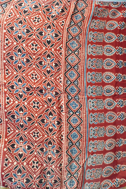 Multicolor checked saree in red, white, blue and black with border and tassels