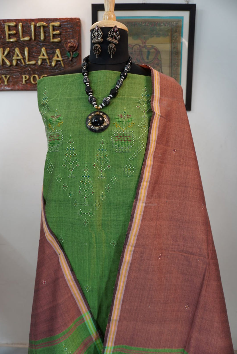 Tangaliya cotton 3 piece suit material in light green with flower detail, border and tassels