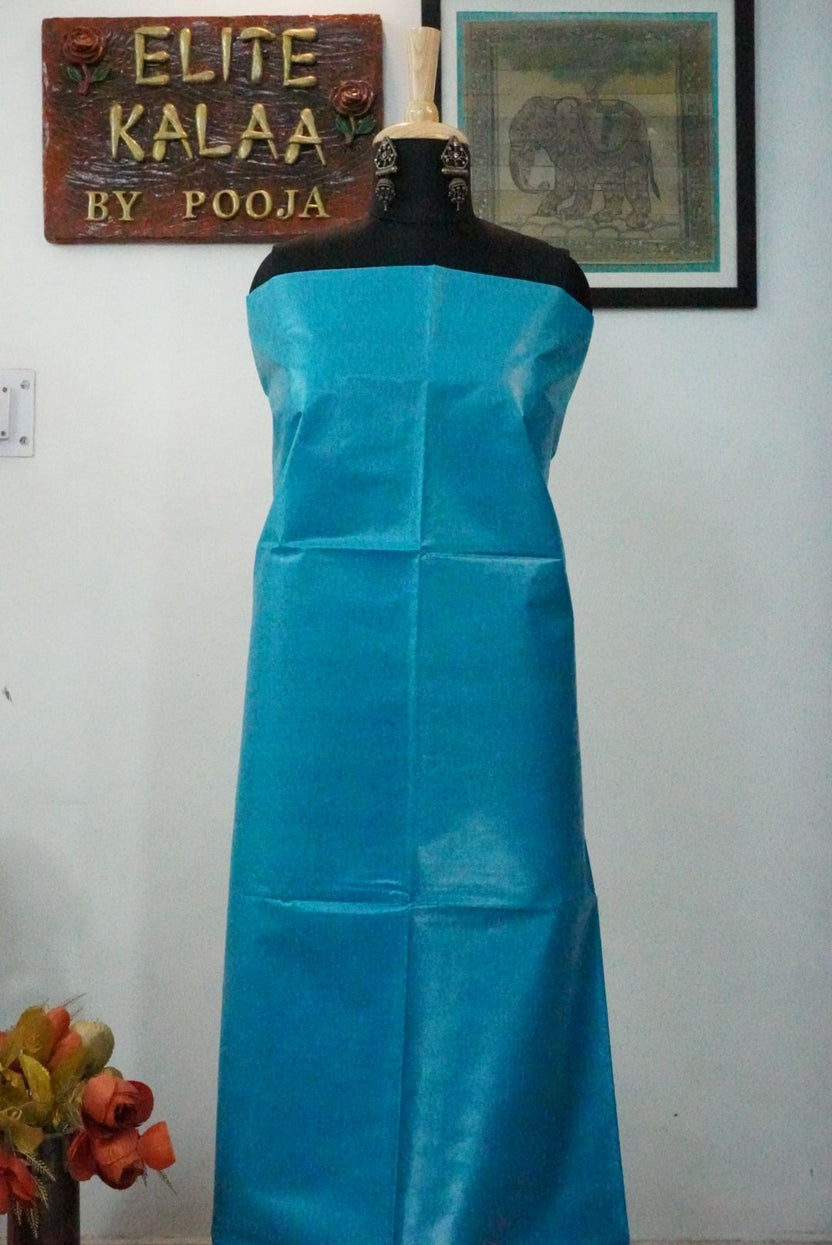 Firozi blue Tusser fabric piece with a solid plain design