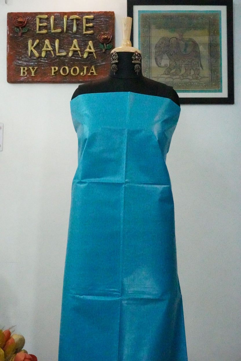 Firozi blue Tusser fabric piece with a solid plain design