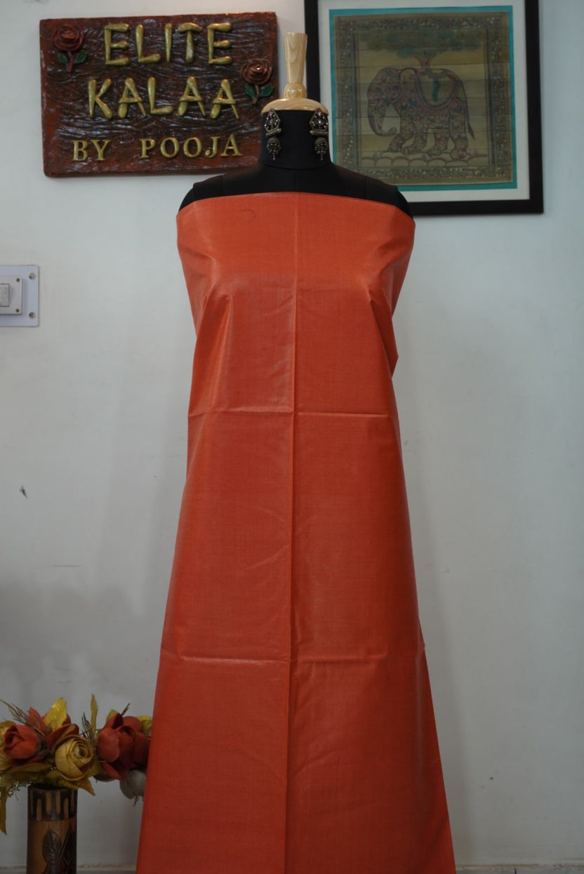 Orange solid Tusser fabric piece with a plain, border-free design