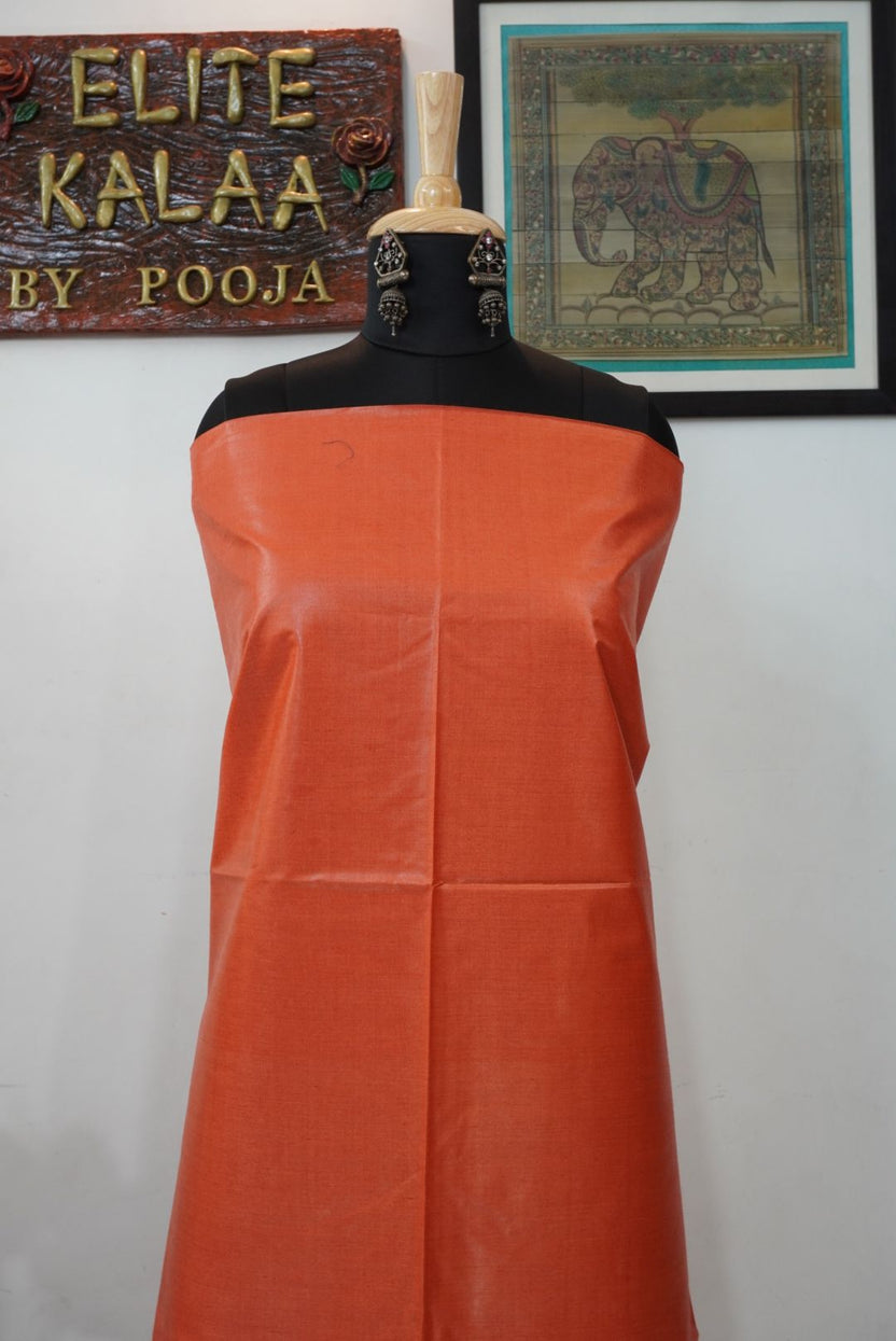 Orange solid Tusser fabric piece with a plain, border-free design