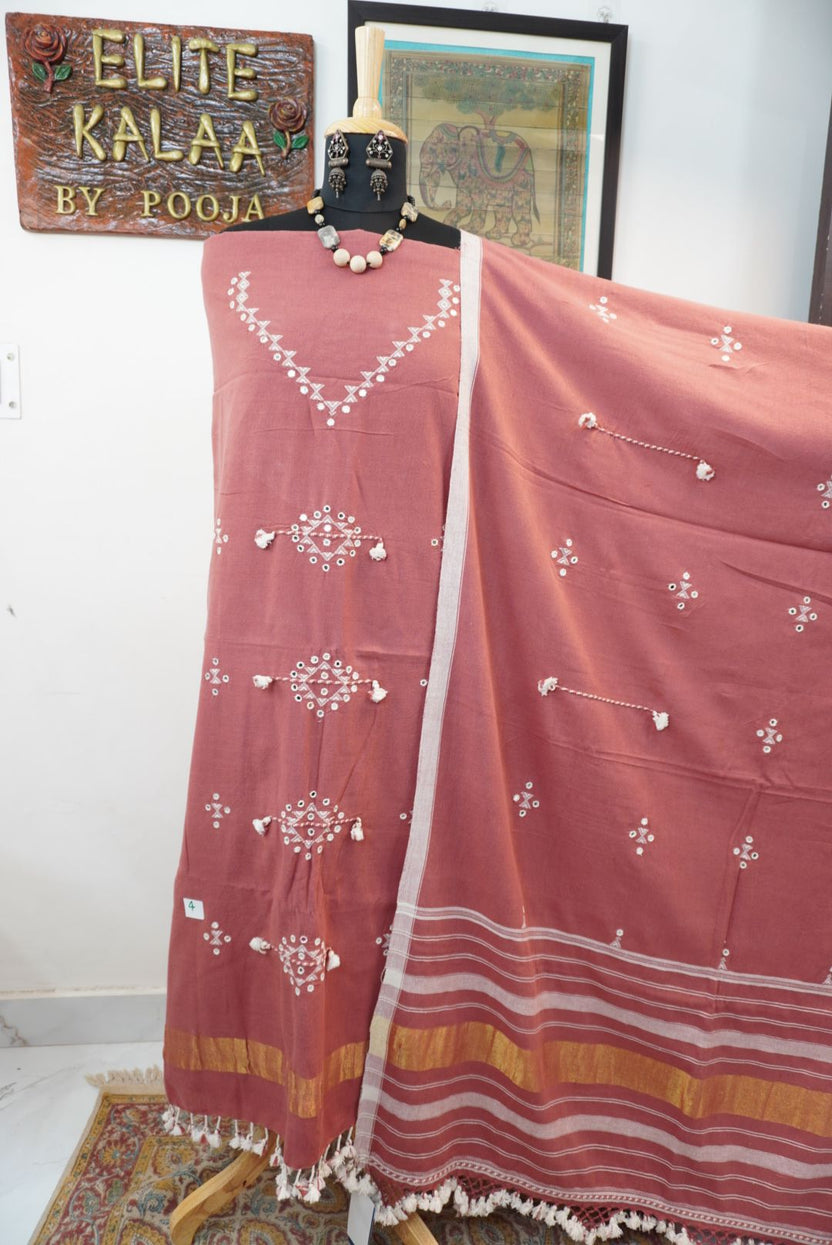 Carrot pink Bhujodi kala cotton suit with multicolor placement pattern, border and tassels